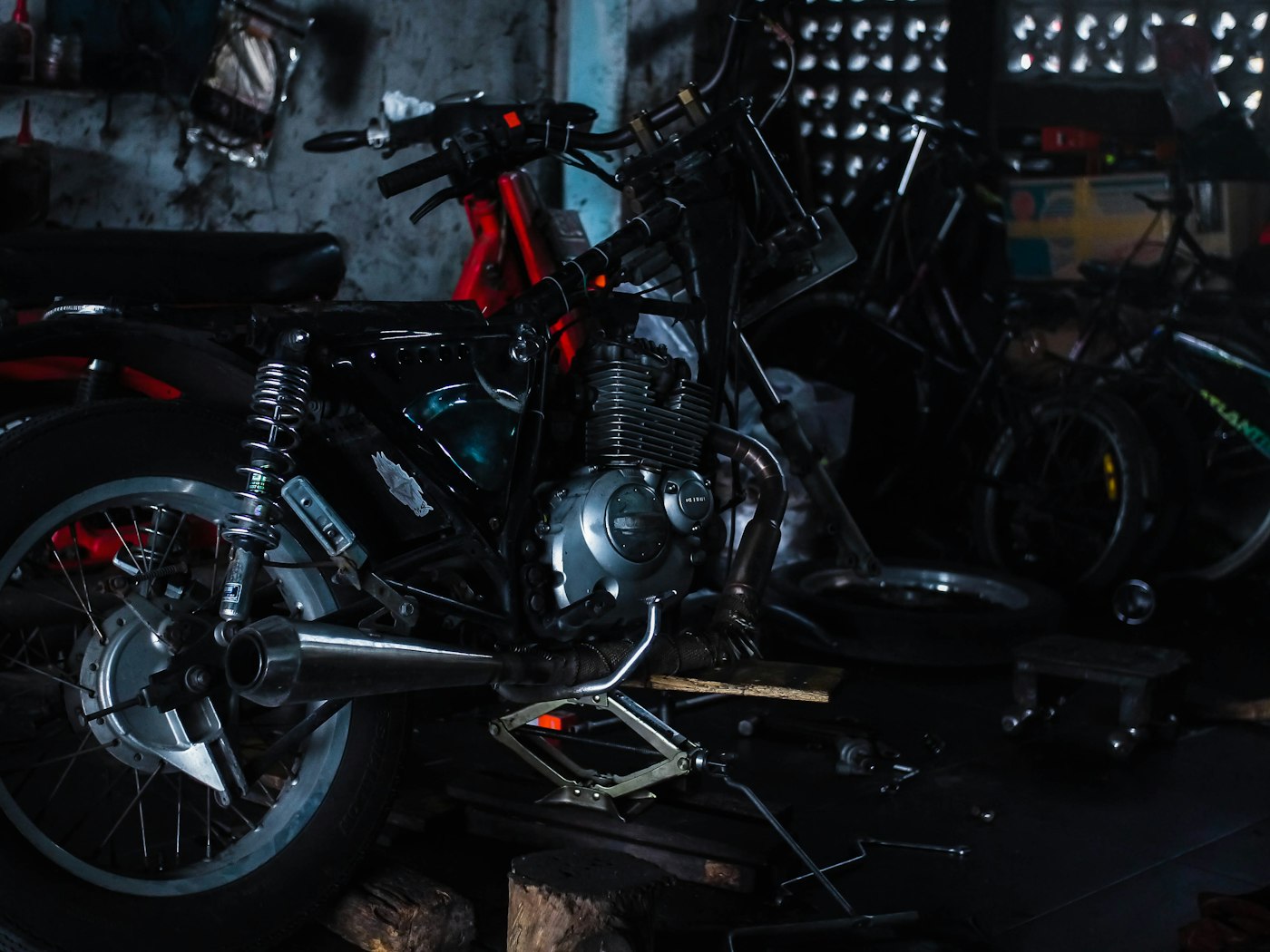 Motorcycle raised on a stand in a repair workshop