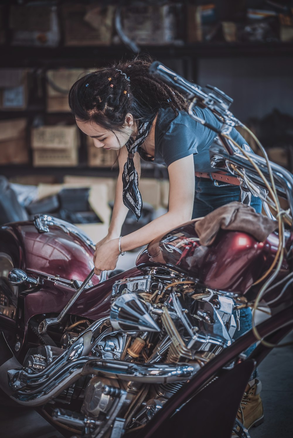 Technician repairing a motorcycle in the workshop