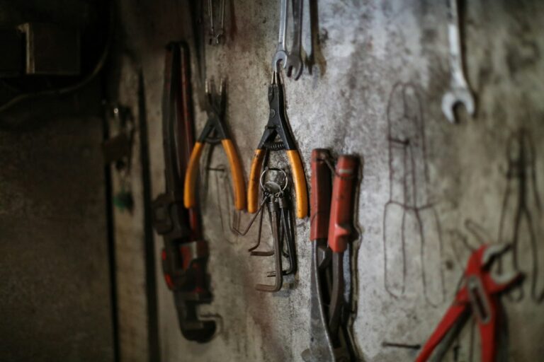 Organised wall of hand tools in a service workshop